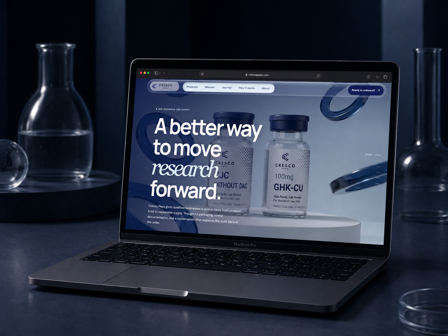 Cresco Peps website shown on a MacBook Pro in a navy laboratory setting